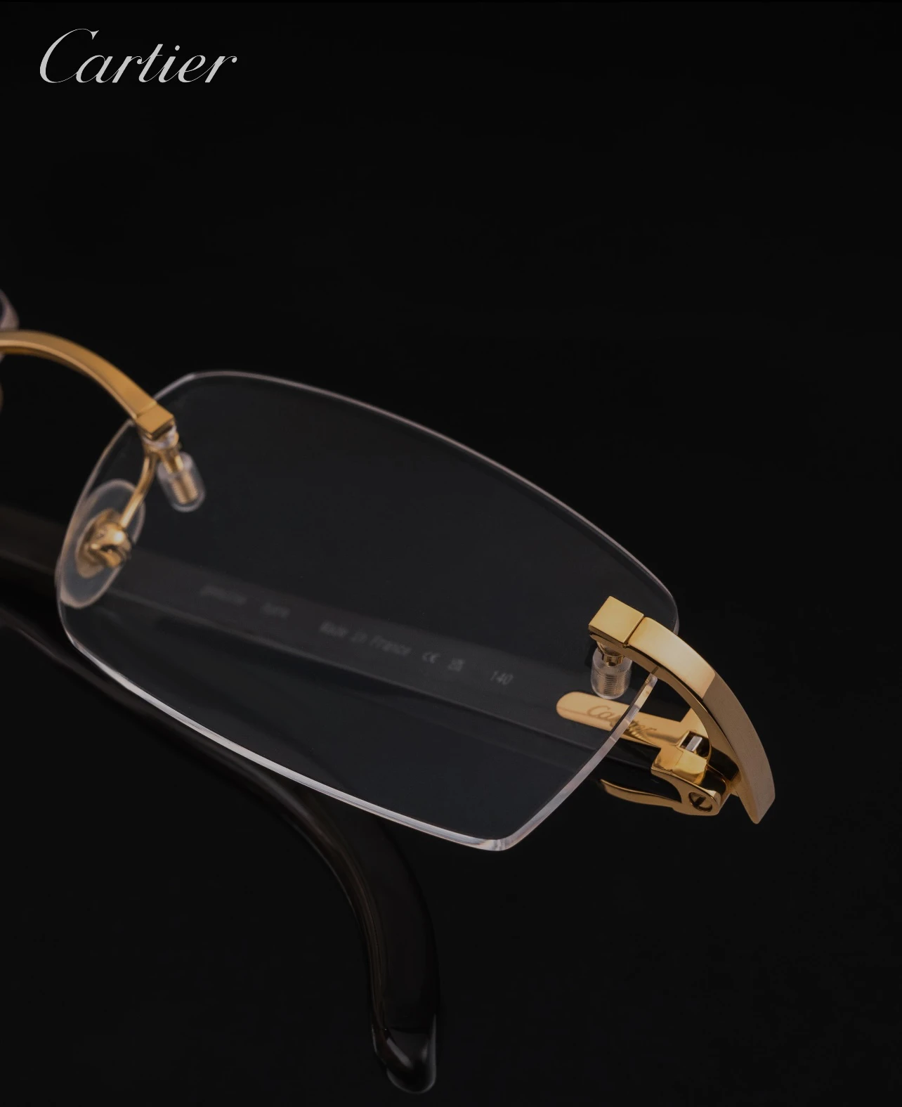 City Specs 2026 Profile view of Cartier CT0049O 001 gold rimless spectacles on display at City Specs Manchester and Sheffield