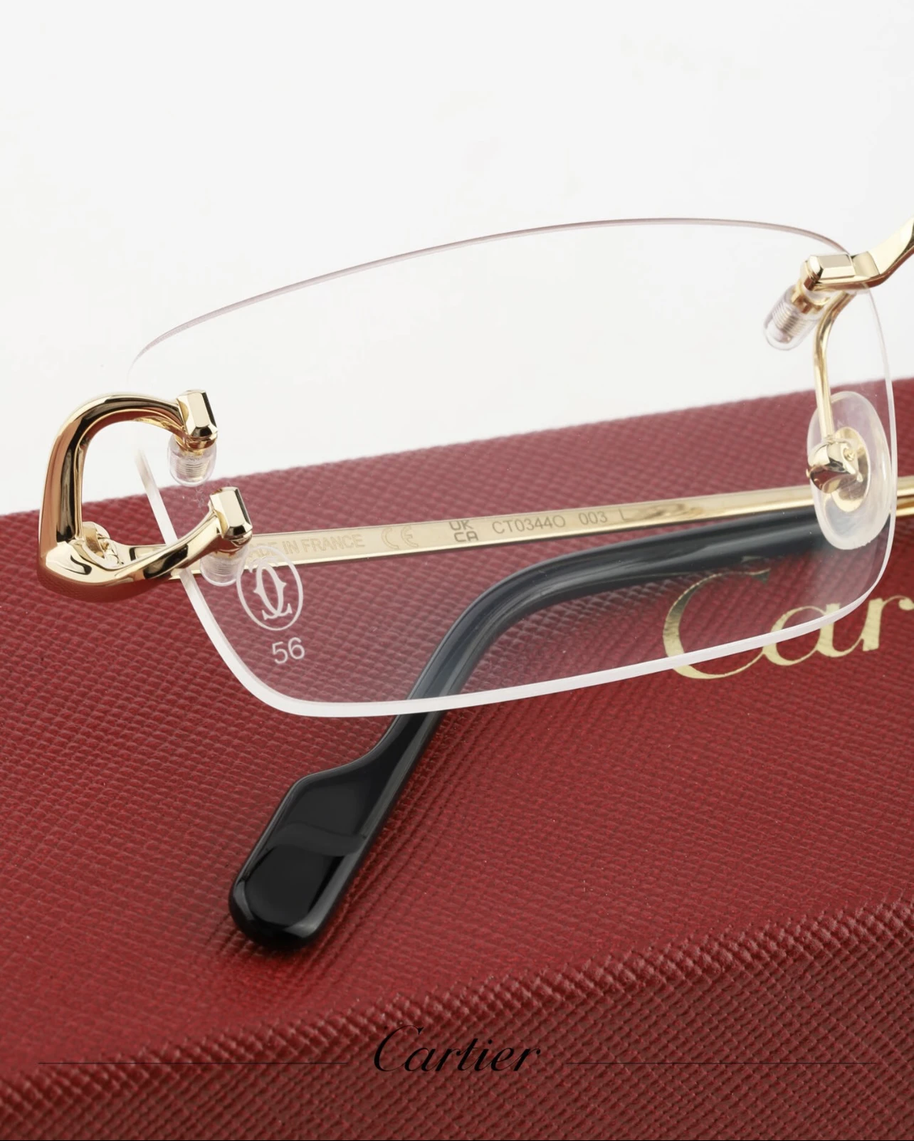 City Specs 2026 Detail of Cartier CT0344O 003 gold rimless glasses on display at City Specs opticians