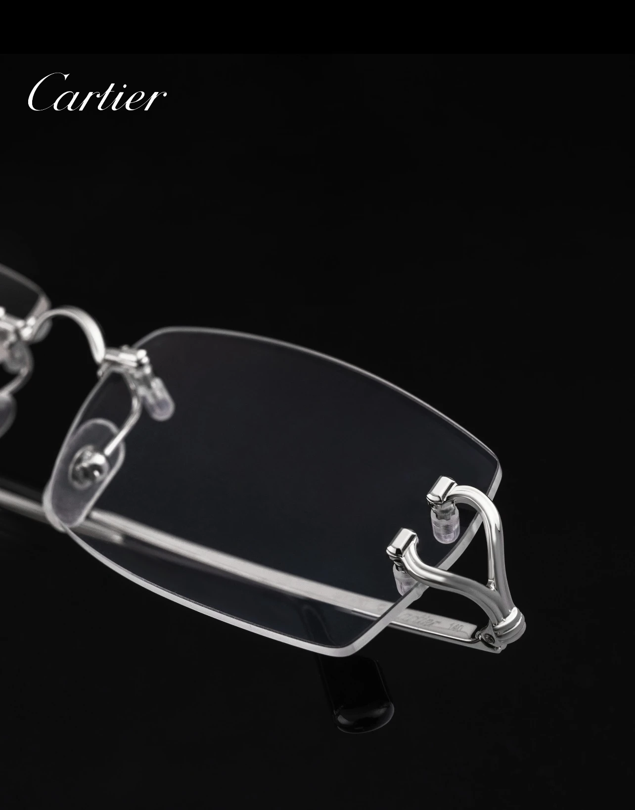 City Specs 2026 Silver open-worked hinge detail on Cartier CT0563O 002 rimless frames at City Specs