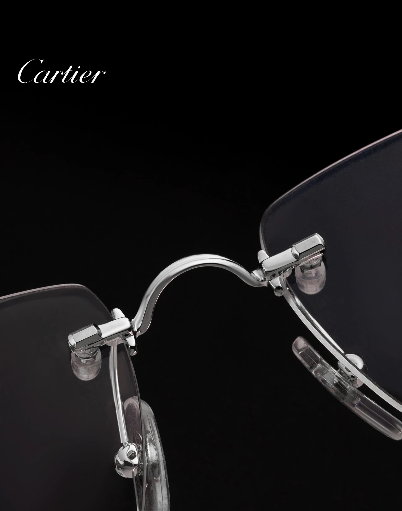 City Specs 2026 Silver open-worked hinge detail on Cartier CT0563O 002 rimless frames at City Specs