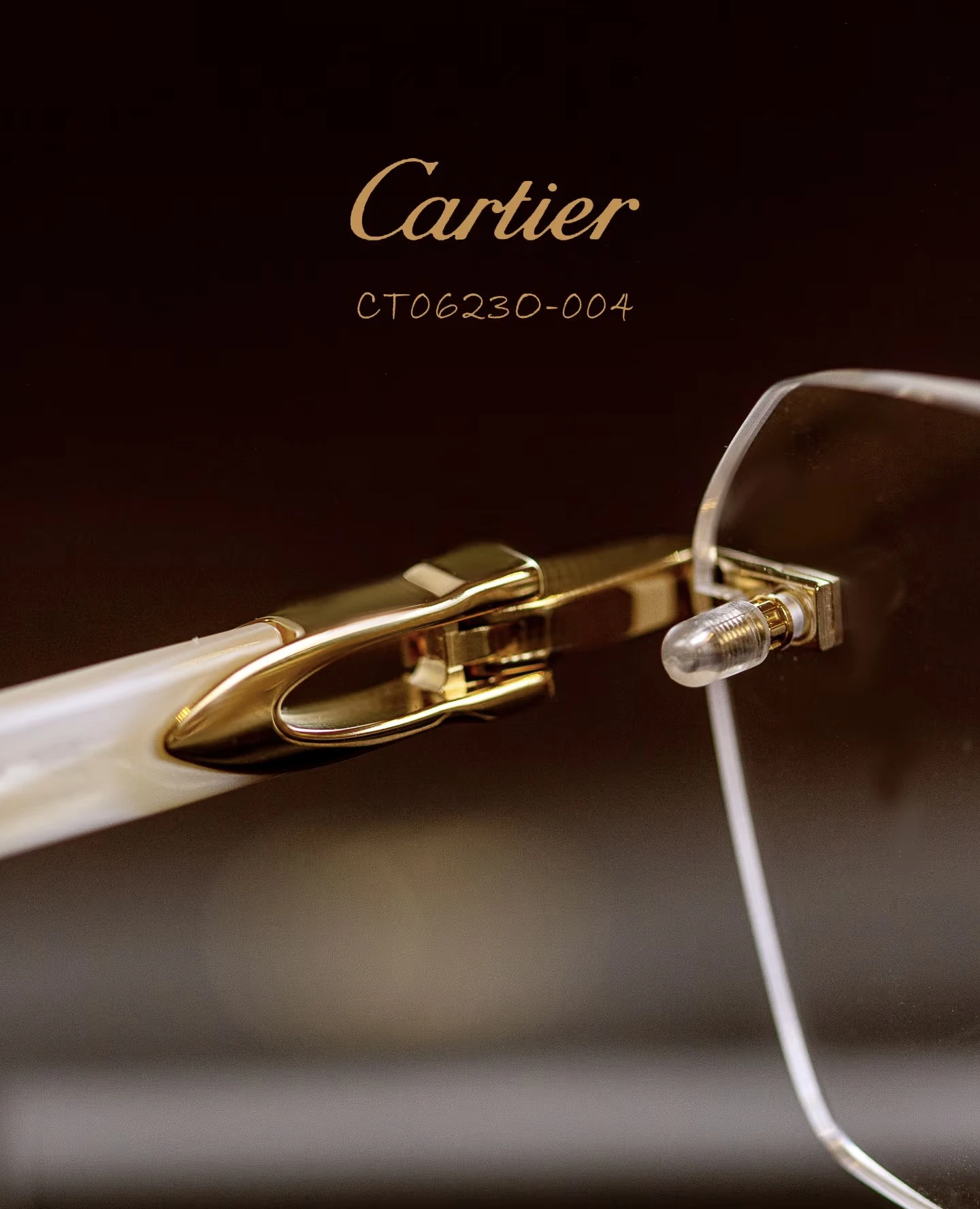 City Specs 2026 View of Cartier CT0623O 004 gold and white rimless glasses on brown case at City Specs opticians